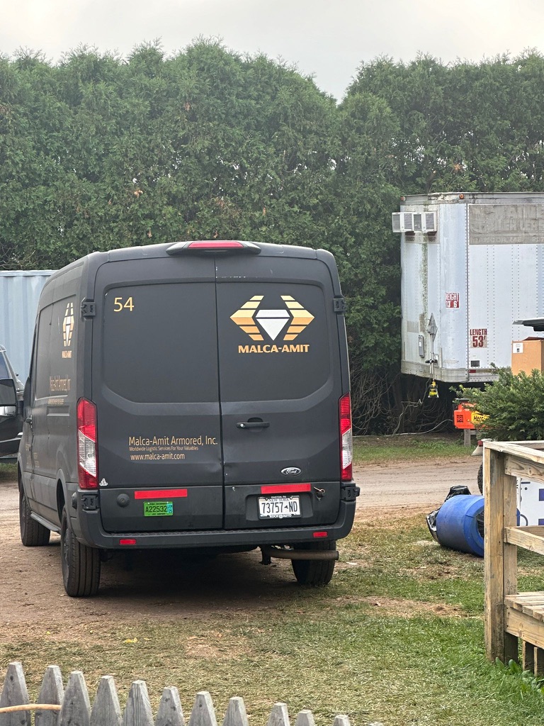 Armored transport vehicle on secure logistics detail